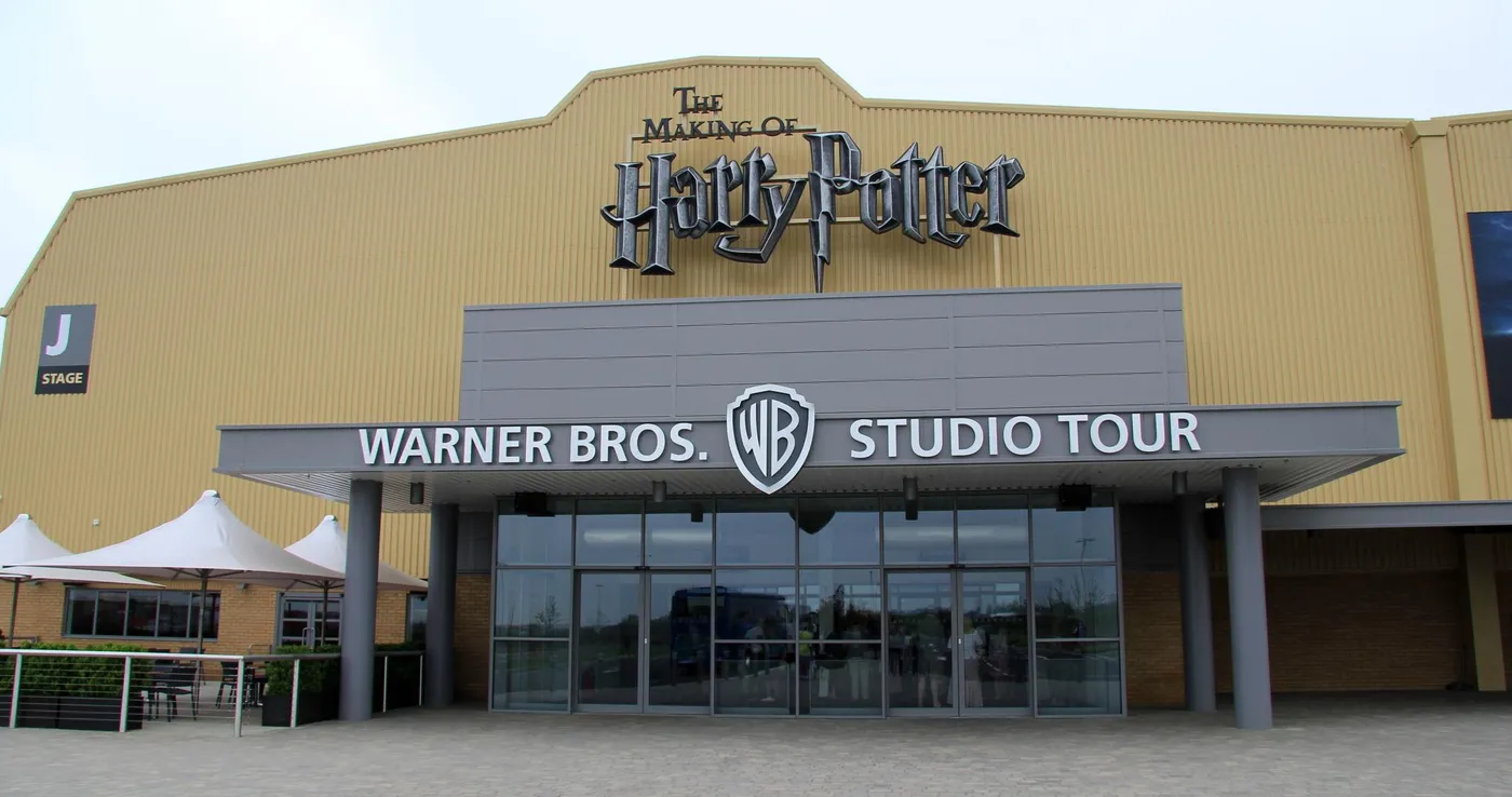 Front view of the Studio Tour entrance with glass doors and a canopy