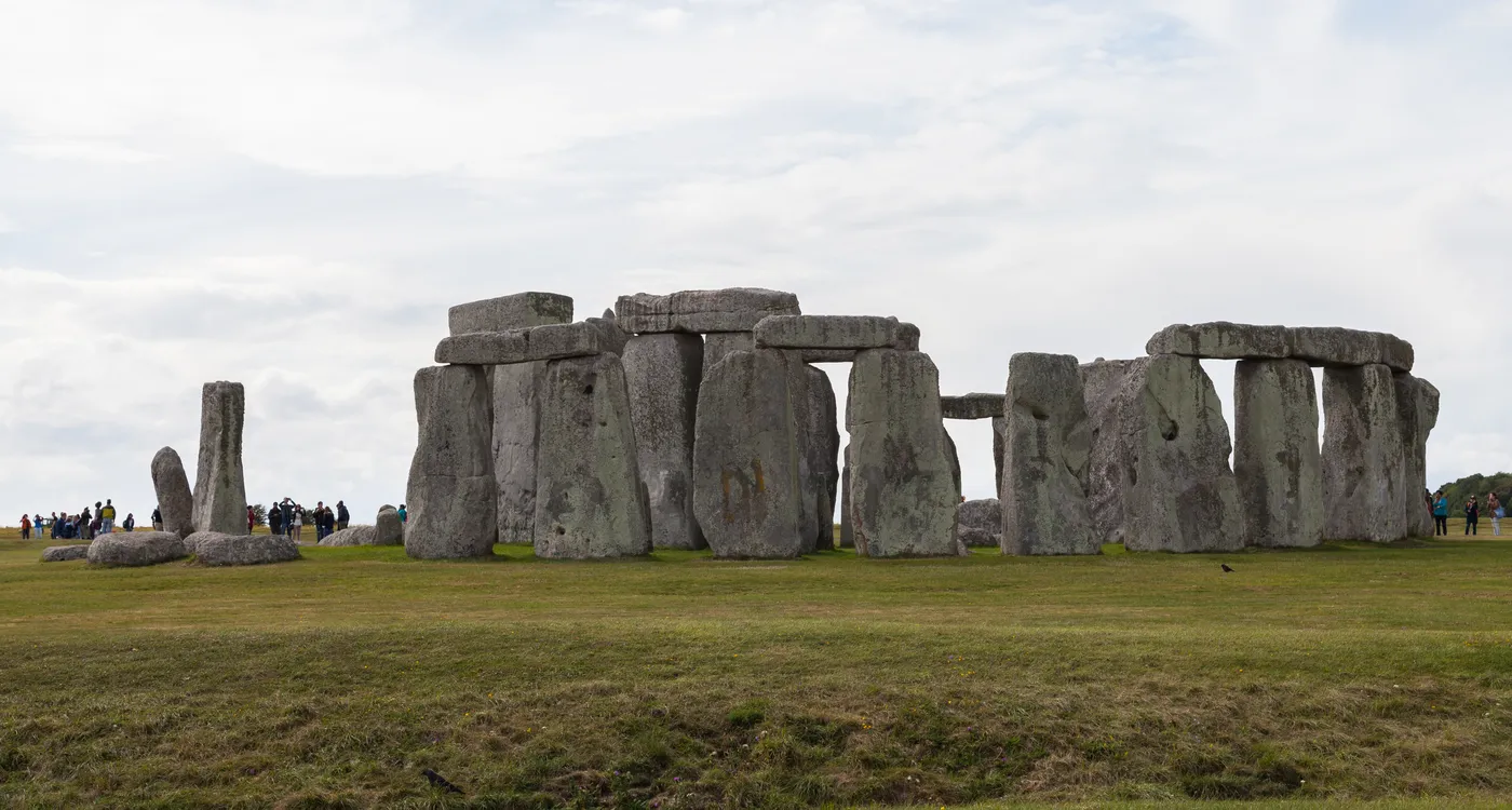 The standing stones of Stonehenge on open grassland