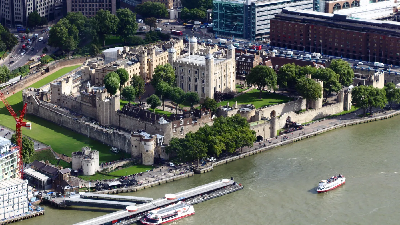 Aerial view of the Tower of London showing its concentric walls beside the Thames